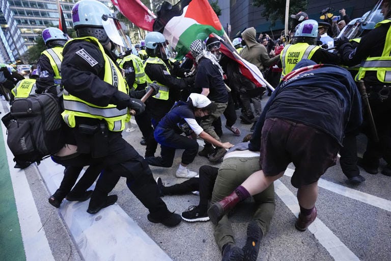 Demonstrators clash with police near the Israeli consulate during the Democratic National Convention on August 20, 2024 [Frank Franklin II/AP]