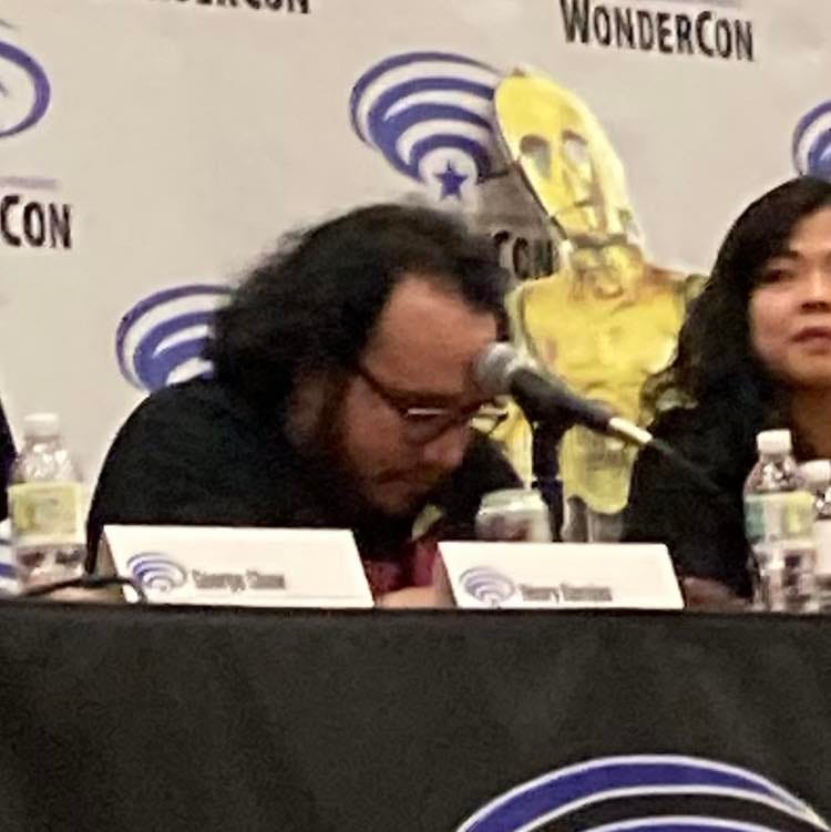 Henry Barajas pressing his forehead against the mic at a Wonder Con panel.