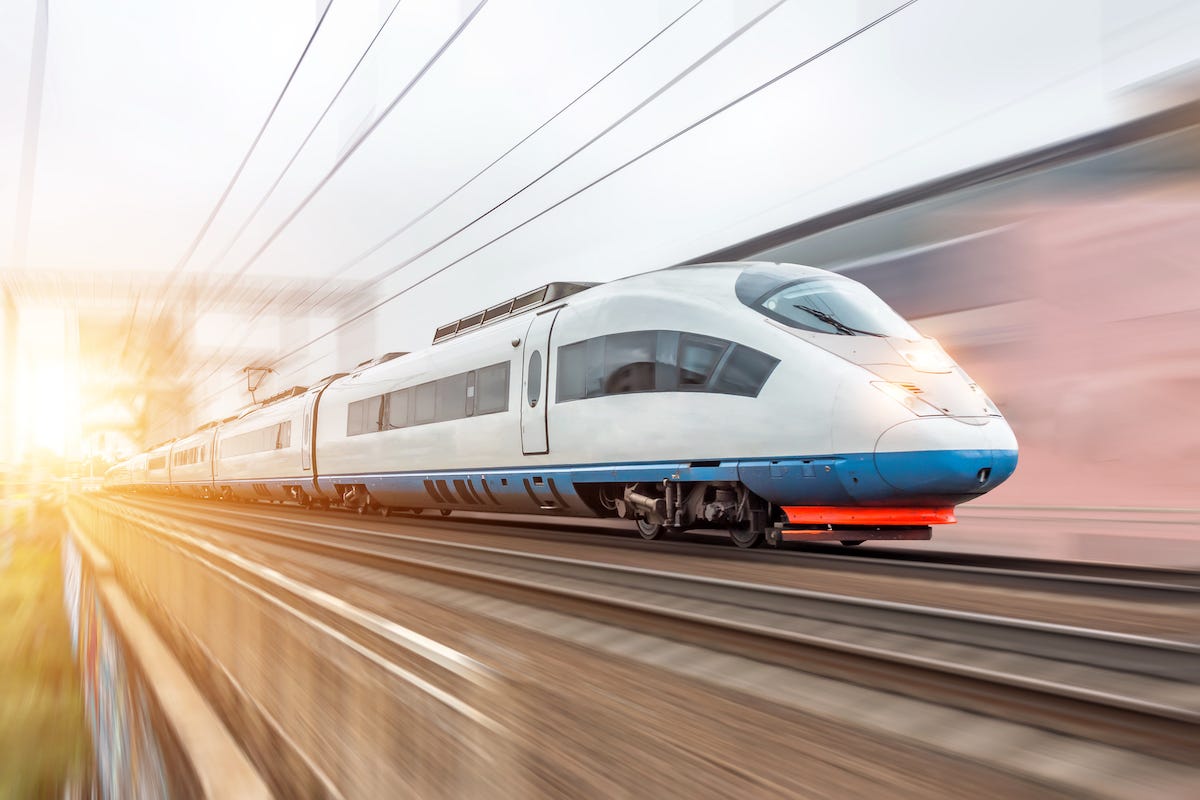 a high speed train speeding along some tracks