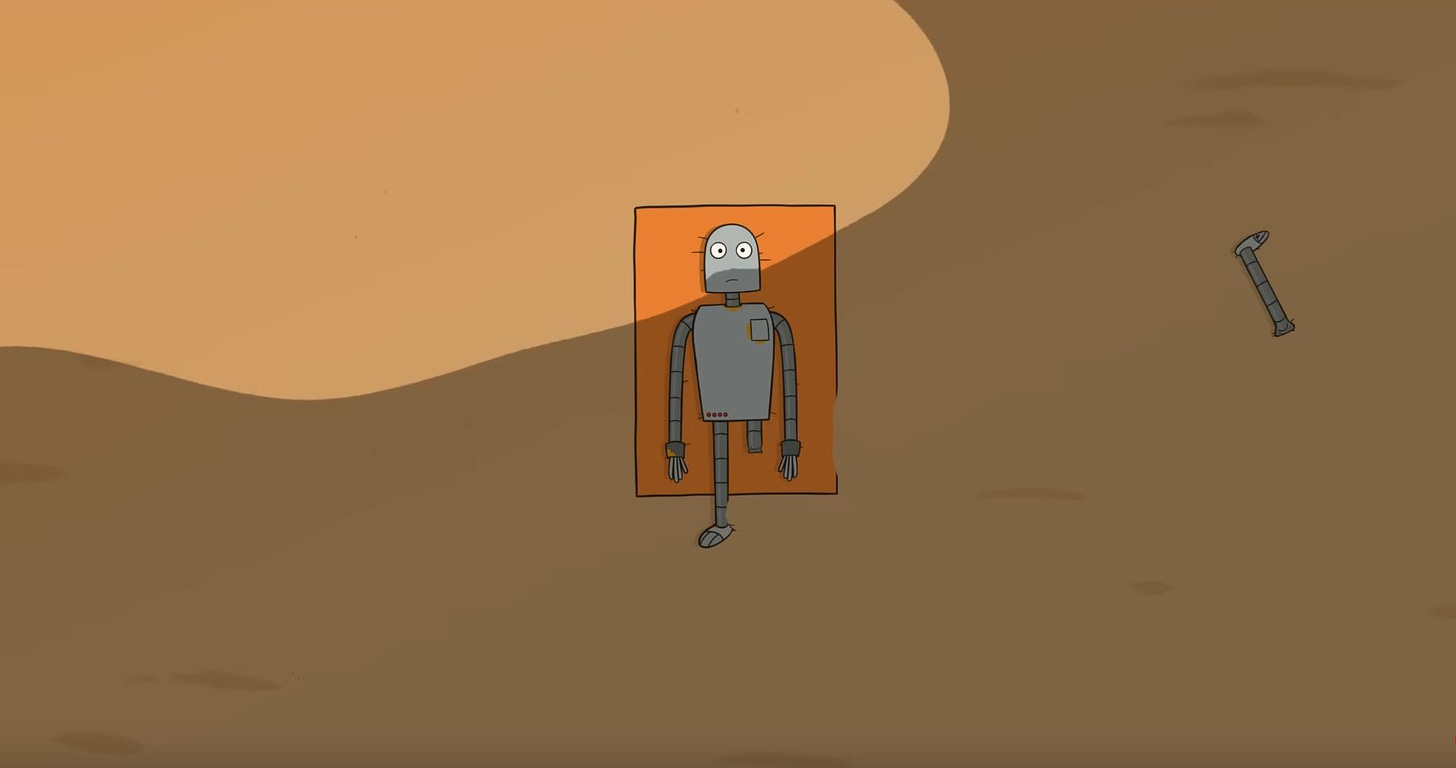 A screenshot from the film Robot Dreams showing Robot abandoned on the beach with a detached leg
