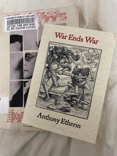 A woodcut of a man in armour and an armed skeleton fighting with swords, the cover of Anthony Etherin's poem, War Ends War. The pamphlet sits on top of a copy of Raymond Queneau's Exercises in Style.