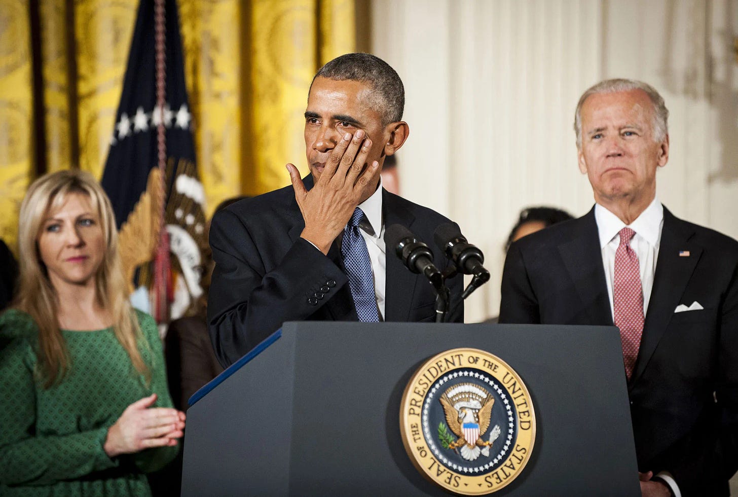 President Obama tearing up at a presidential podium at the White House