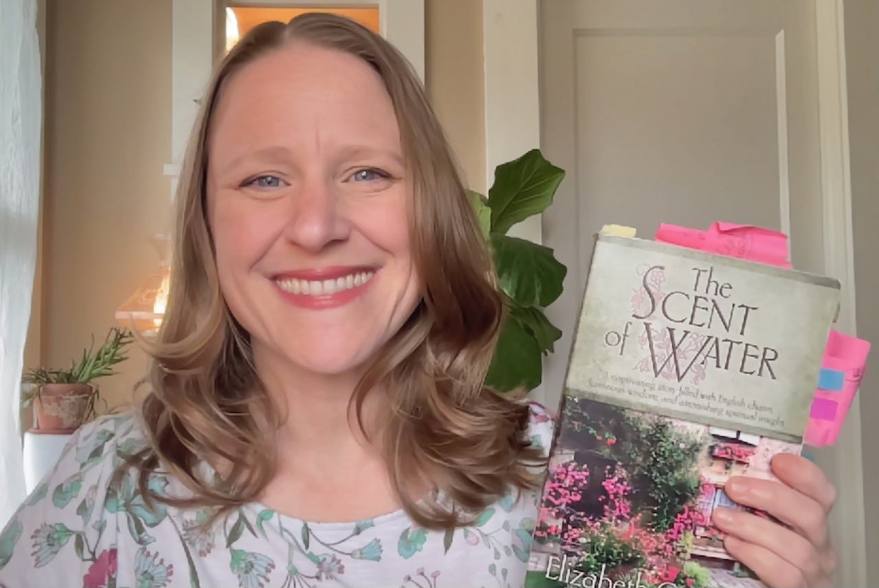 Julie Witmer with her paperback copy of The Scent of Water