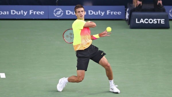 borna coric returns to roger federer dubai tennis open 2015