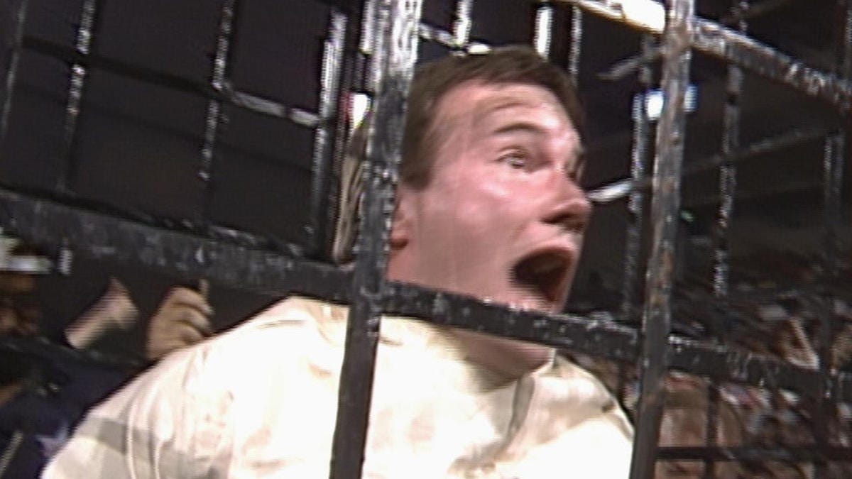 Jim Cornette is suspended above the ring in a cage: Great American Bash  1988 | WWE