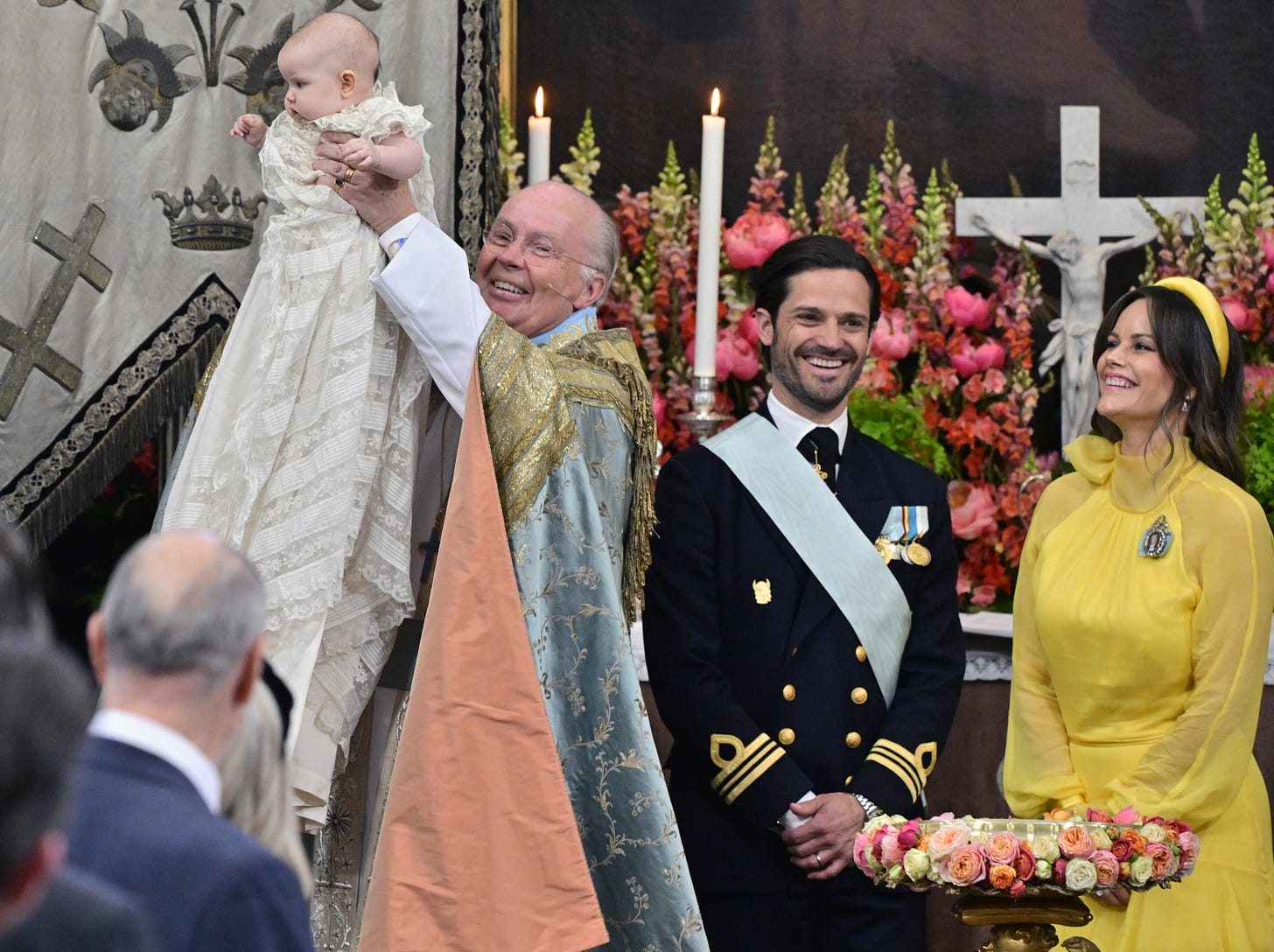 Princess Ines held in air after baptism