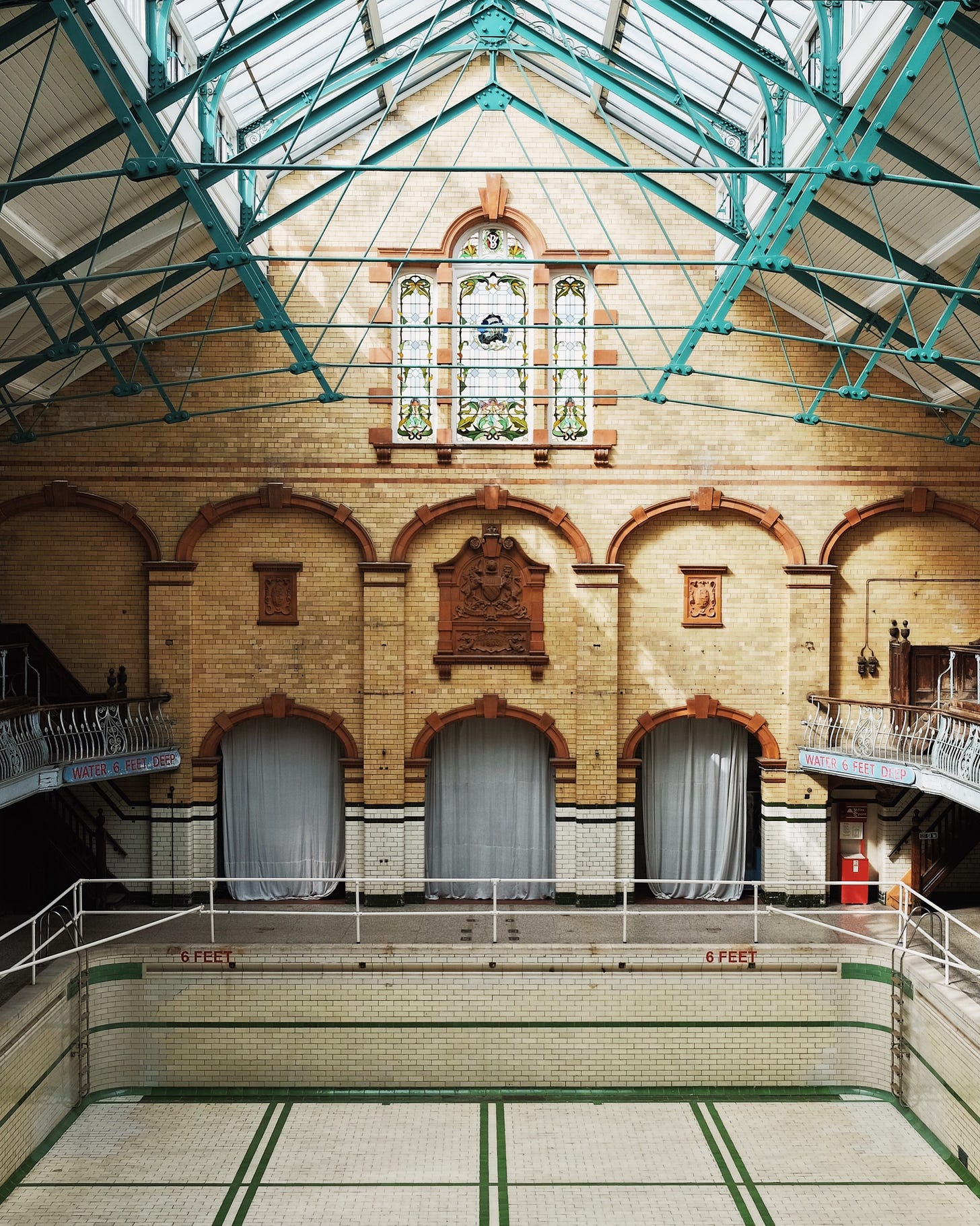 A photo of an empty pool at the Victoria Baths in Manchester, UK