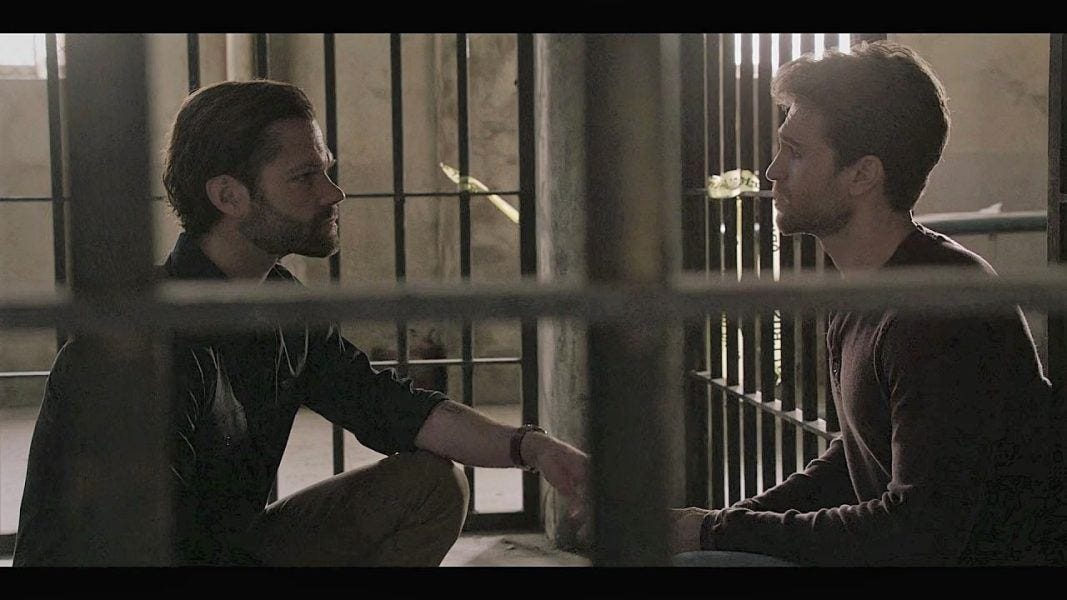 Jared Padalecki and Keegan Allen holding hands before hot prison scene on Walker 3.06.