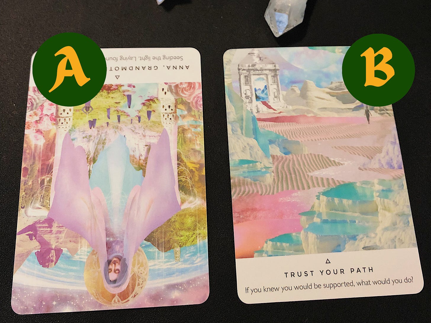 An unpsidedown Anna, Grandmother of Jesus oracle card on the left, and a Trust Your Path oracle card on the right.