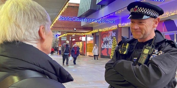 Officer chatting to a customer in a shopping centre