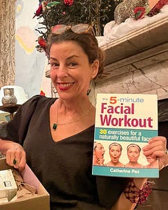me Kim holding up a book called facial workout