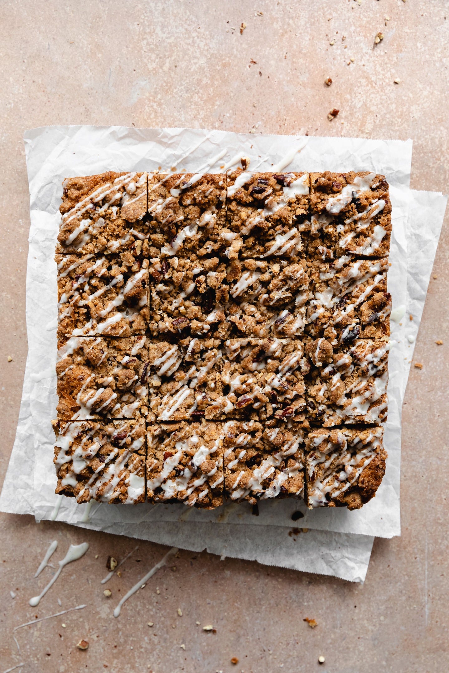 Top view of sliced vegan cinnamon streusel coffee cake on parchment paper