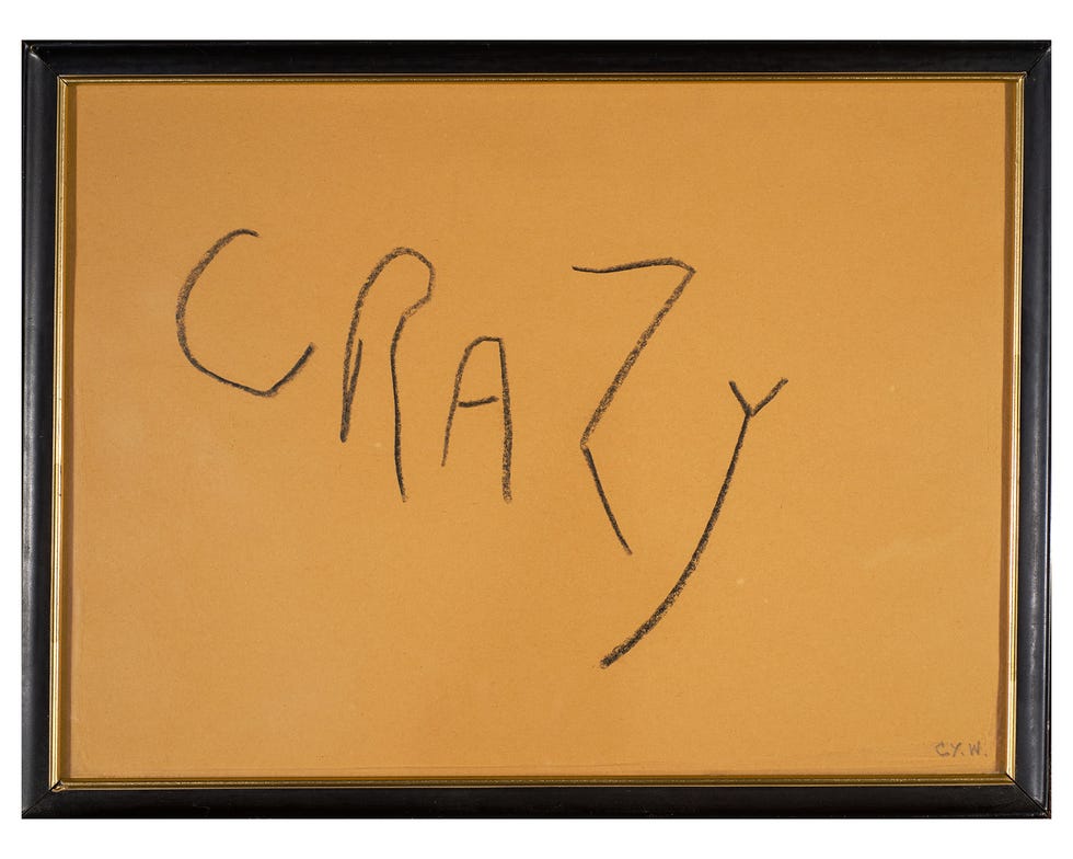 A framed image of the word "Crazy"