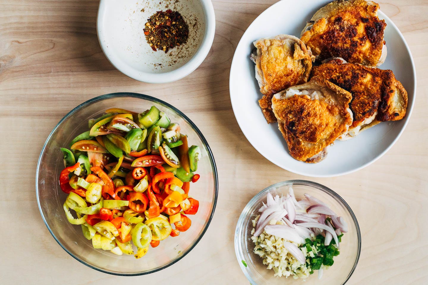 Ingredients for coconut milk-braised chicken on a table.