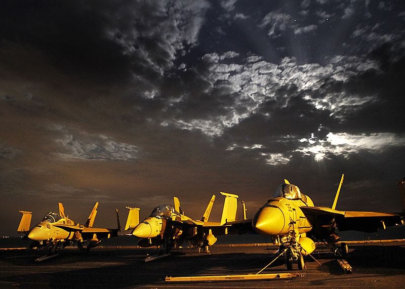 Wars and Rumors of Wars Title Photo - US Navy Jets against background of storm clouds