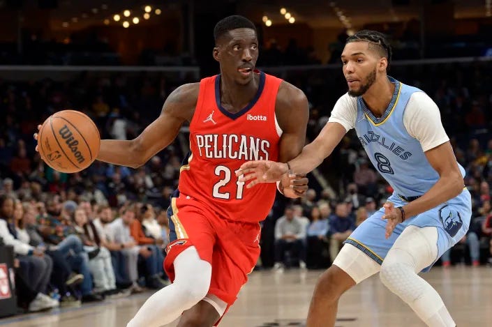 New Orleans Pelicans forward Tony Snell is defended by Memphis Grizzlies guard Ziaire Williams (8) in the first half of an NBA basketball game Tuesday, March 8, 2022, in Memphis, Tenn. (AP Photo/Brandon Dill)