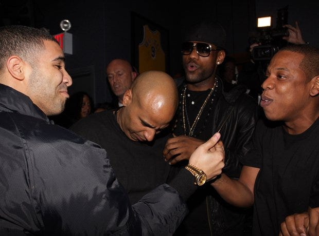 Drake and Jay-Z embracing.