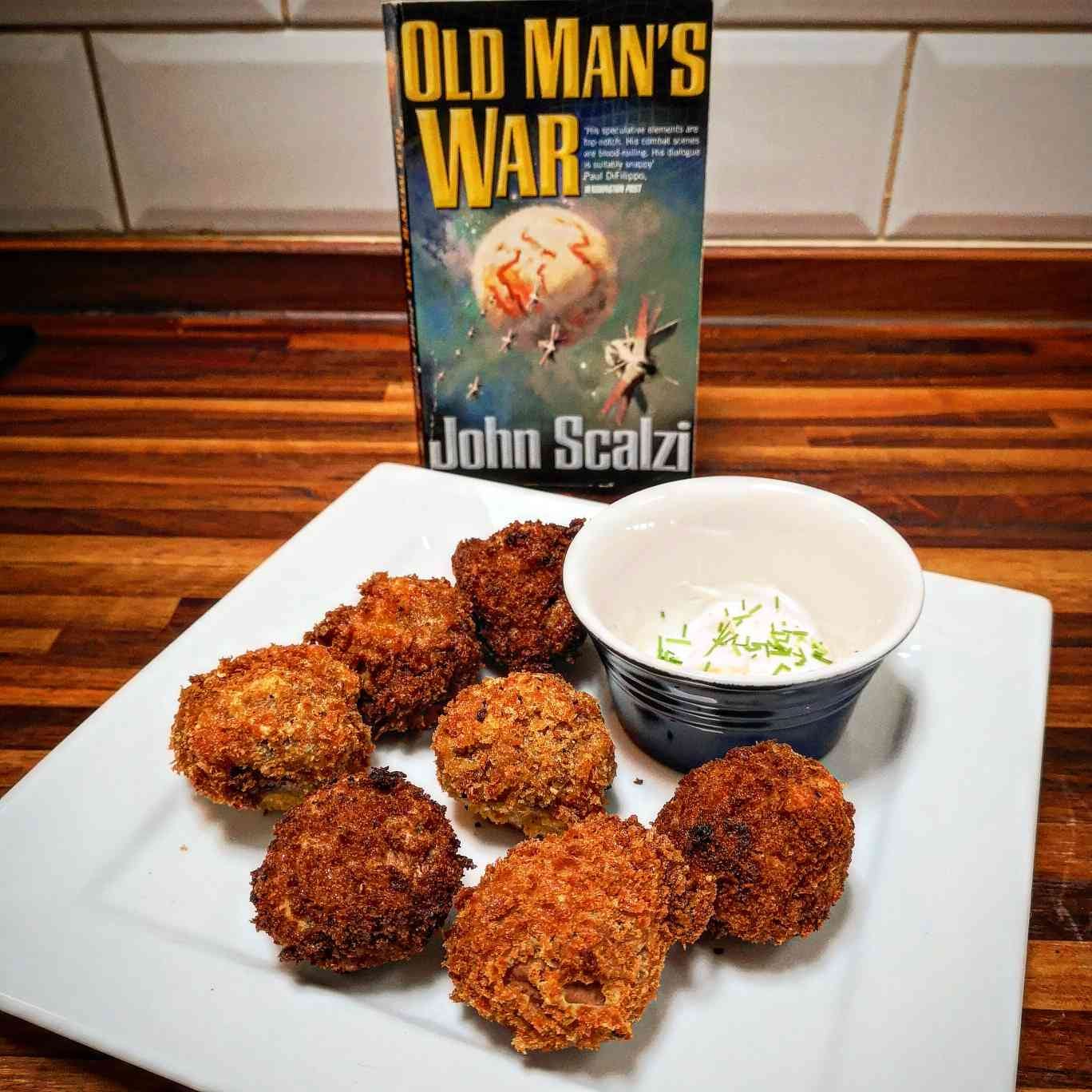 Old Man's War by John Scalzi behind a plate full of balls. Mushroom balls, that is. And a mayo and chives dipping sauce.
