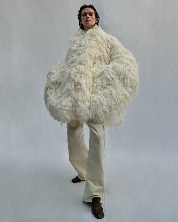 The giant fuzzy ivory coat from the new line looks like a wearable shag rug.