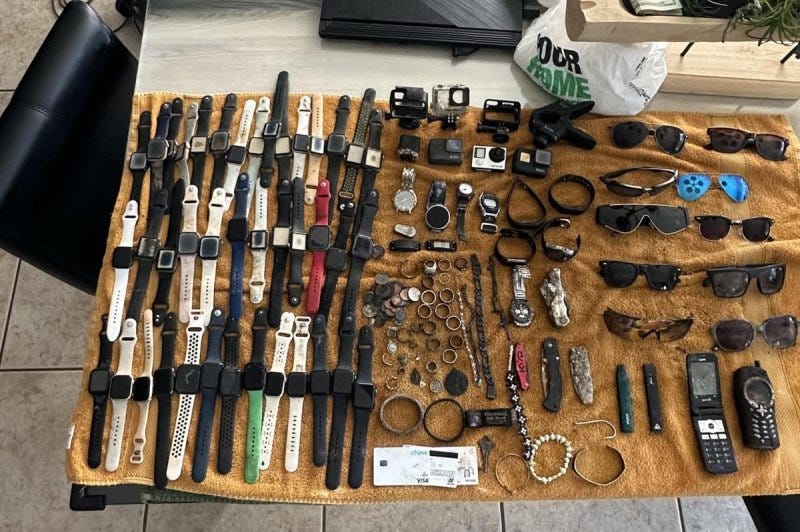 Scuba diver Darick Langos said the items he has recovered from the water at Indiana's Chain O' Lakes State Park include about 200 Apple Watches. Photo courtesy of Scuba Bear Diving Recovery Service/Facebook