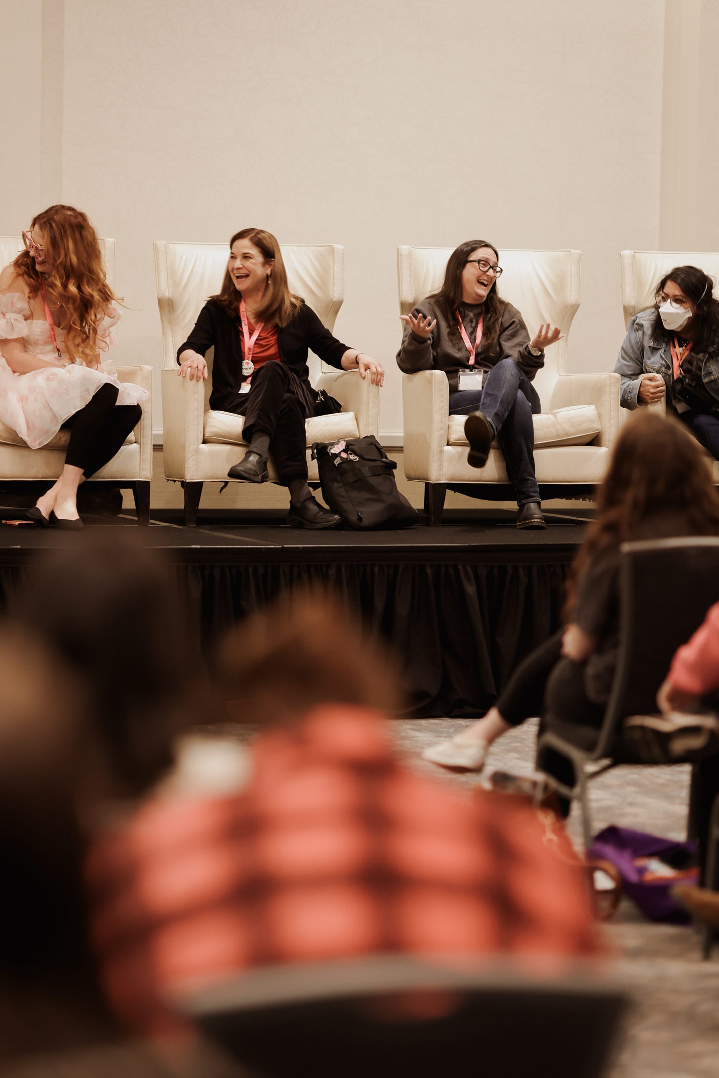 Photo of Serena Kaylor, Ginny Baird, me, and Preeti Chhibber, where I am holding up my hands and laughing in a deranged matter.