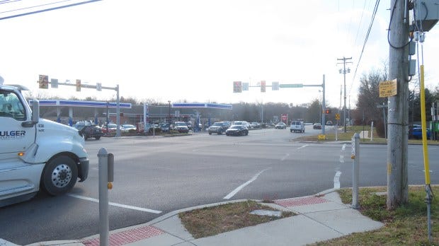 Cars and trucks make turns at the intersection of Sumneytown Pike and Valley Forge Road, where a gas station and Wawa convenience store stand on the Upper Gwynedd side of the intersection, as seen in Nov. 2023. (Dan Sokil - MediaNews Group)