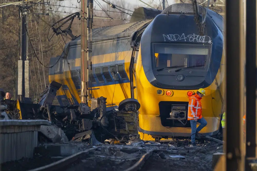 At least one person died and some 30 passengers were injured in the early hours when a train partially derailed, in Voorschoten, near The Hague, Tuesday April 4, 2023, sending at least one carriage into a field next to the tracks. (AP Photo/Peter Dejong)