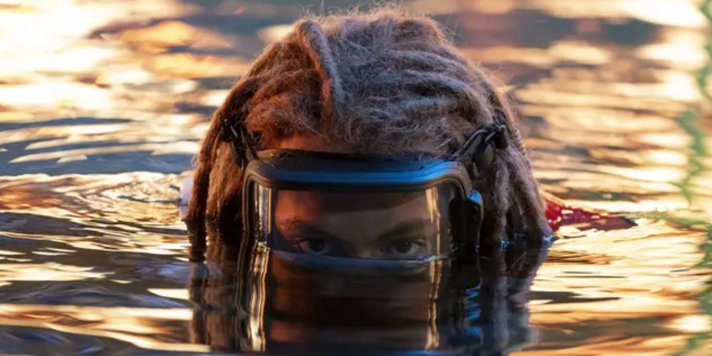 Spider and his dreads rising up out of the ocean
