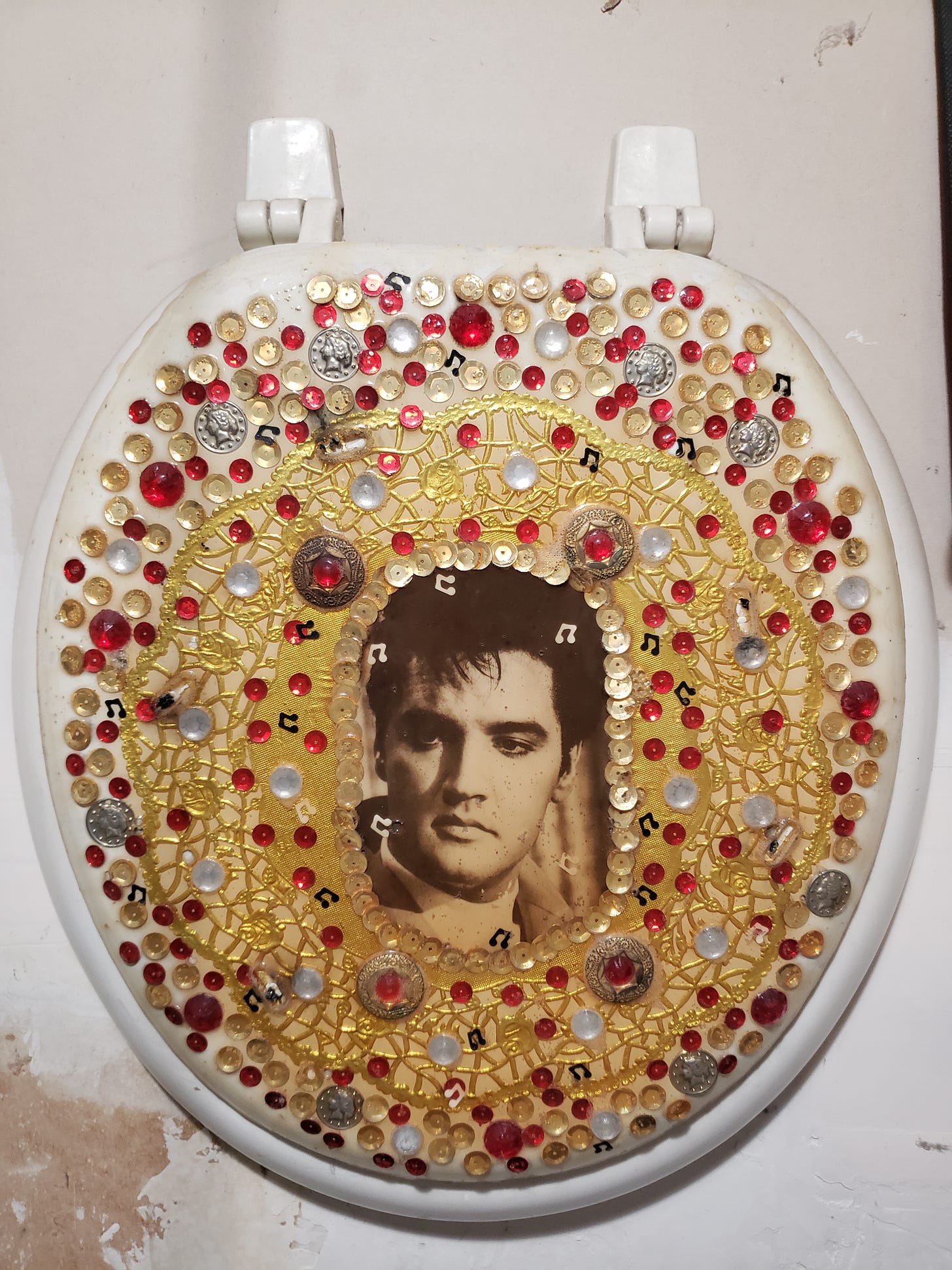 Elvis on a toilet seat