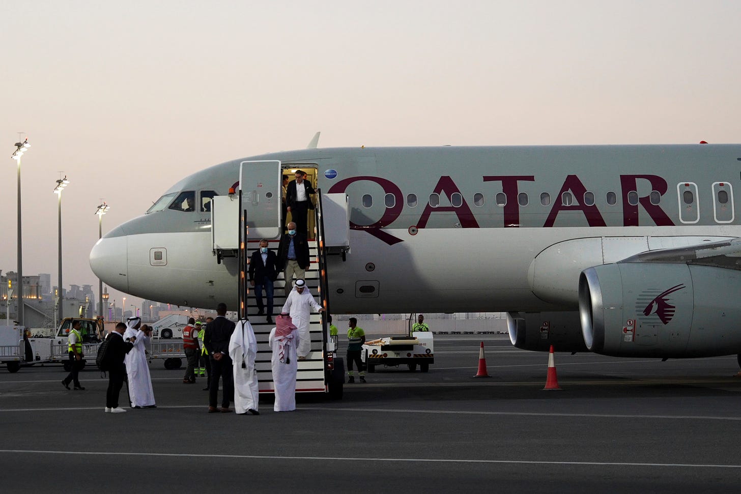 Emad Sharghi, Morad Tahbaz and Siamak Namazi, former prisoners in Iran, walk out of a Qatar Airways flight that brought them out of Tehran and to Doha, Qatar, Monday, Sept. 18, 2023.
