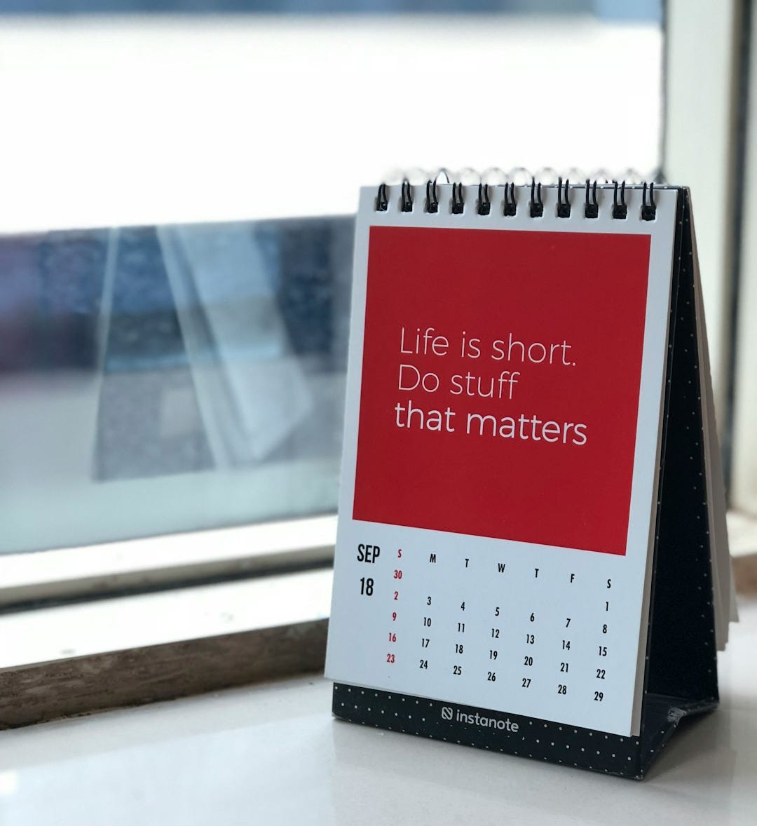 spiral freestanding calendar on white surface