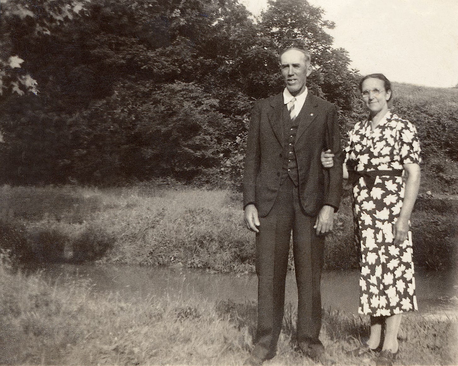 Perry & Lula Padgett standing next to a creek on their property on Blue Ball Hill