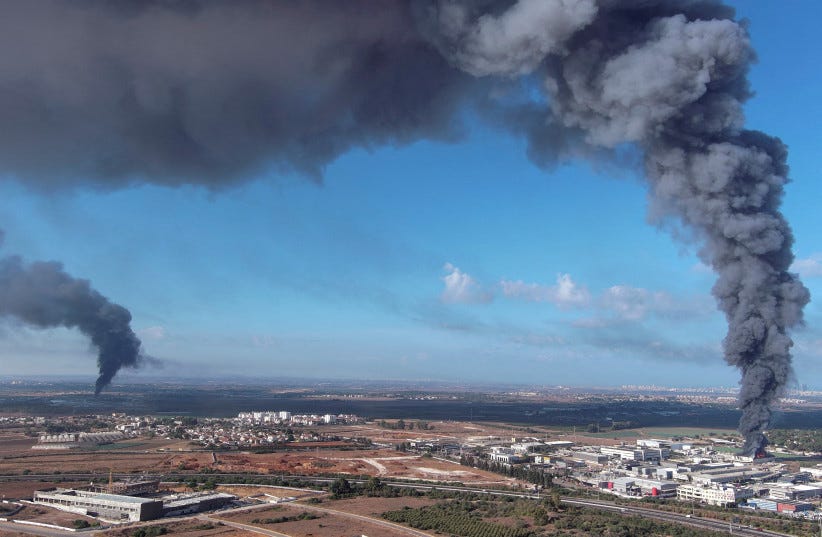  Smoke is seen in the Rehovot area as rockets are launched from the Gaza Strip, in Israel October 7, 2023. (photo credit: REUTERS/ILAN ROSENBERG)