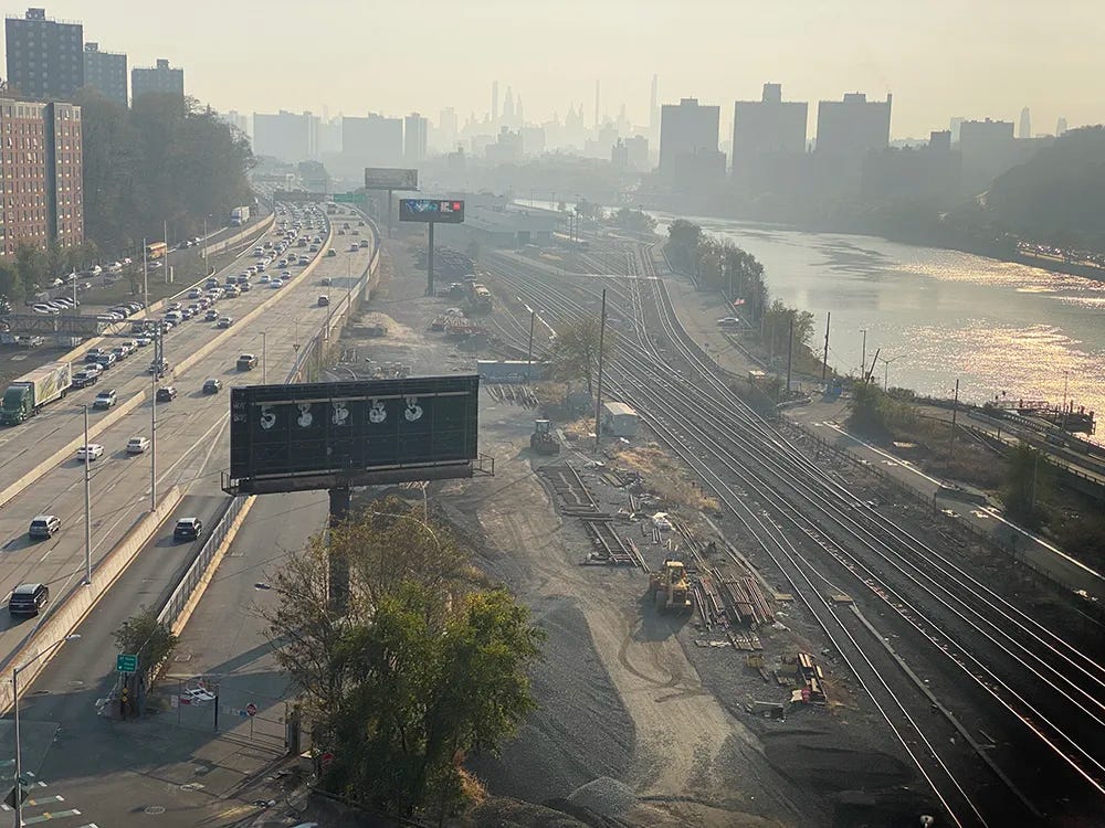 Major Deegan Expressway, Metro North Tracks, Harlem River and Manhattan's billionaire's row in the distance, obscured by wildfire smoke