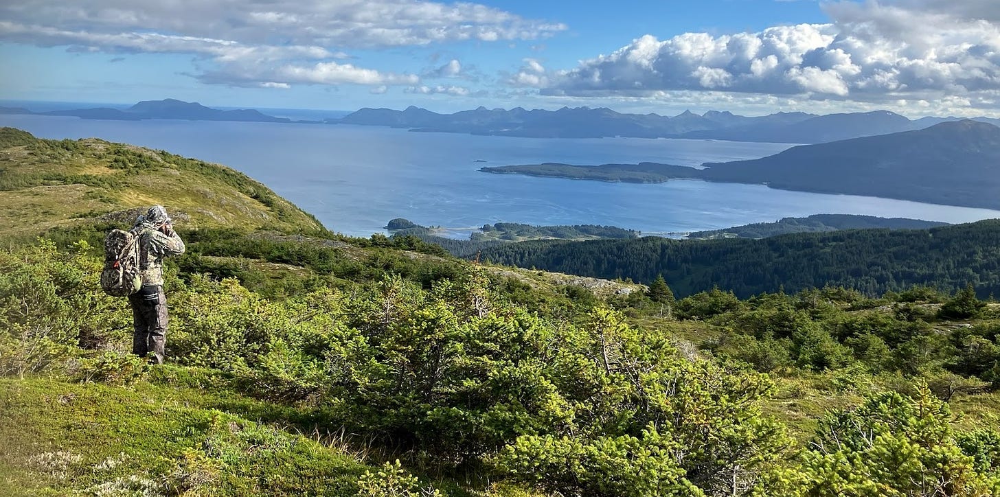 Jesse McEntee glassing for deer on remote island in Alaska.