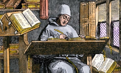 Medieval scribe writing at a desk surrounded by open manuscripts.