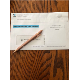 A pen on a envelope

Description automatically generated