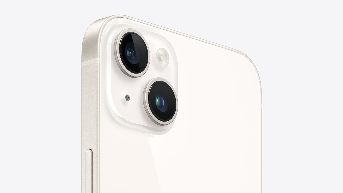 Angled close-up view of the dual-camera system on iPhone 14 Plus in starlight.