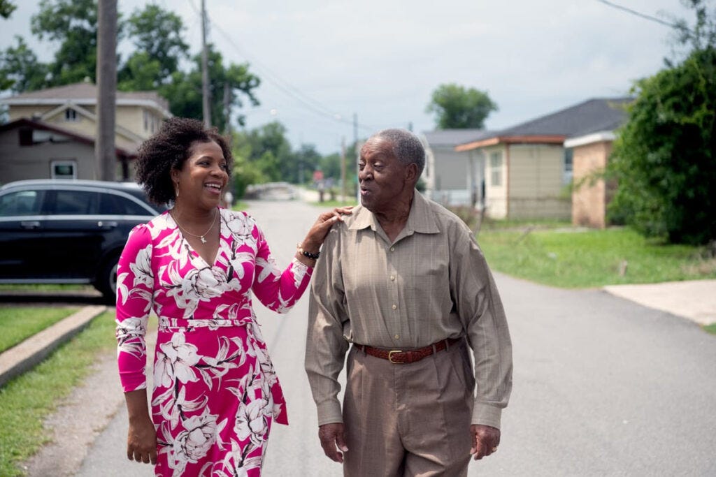 Kimbrelle Eugene Kyereh, who is leading the fight against a proposed ammonia plant walks down the street with her father, Alphonse Eugene Sr.