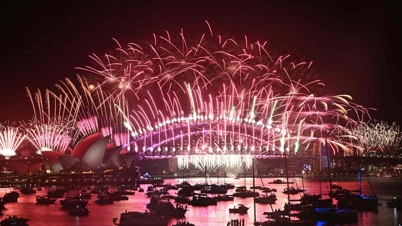 Fireworks light up the midnight sky over Sydney Harbour Bridge and Sydney Opera House during 2025 New Year’&#128;&#153;s Day celebrations in Sydney on January 1, 2025. (Photo by Saeed KHAN / AFP)