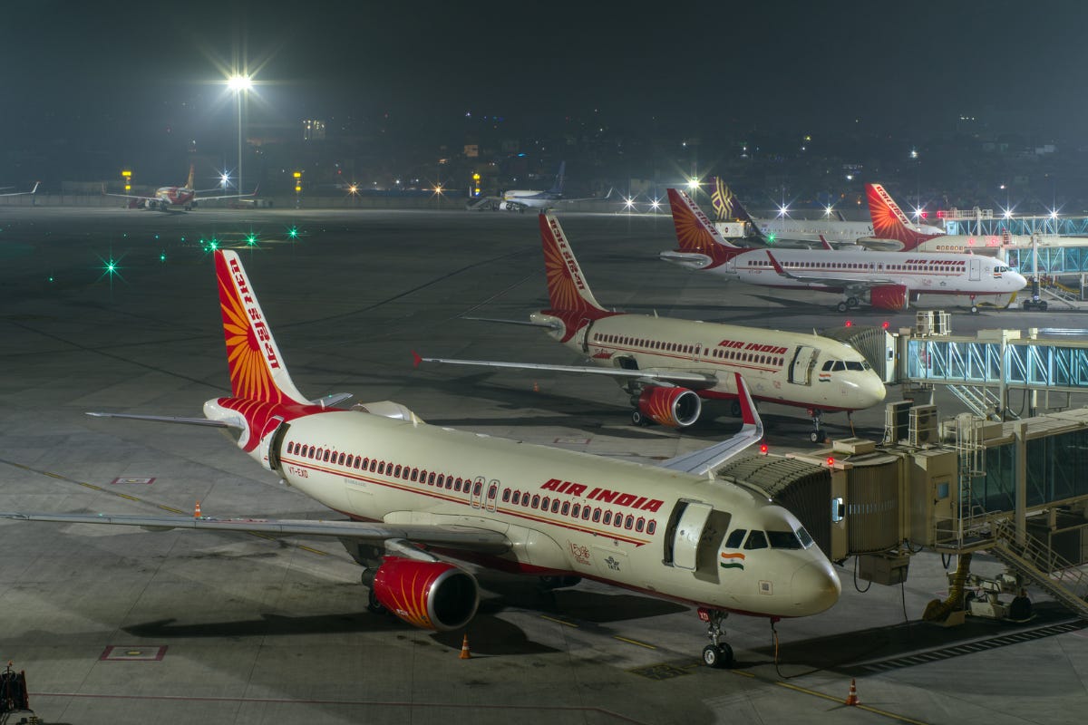 airplanes parked at an airport