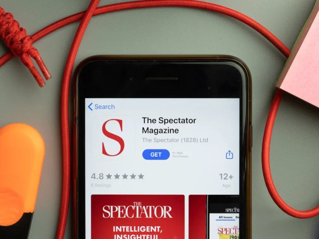 The Spectator Magazine app store is seen on a phone screen, illustrating a story about Paul Marshall's successful acquisition of the magazine. Marshall has vowed to fix "underinvestment" in the title.