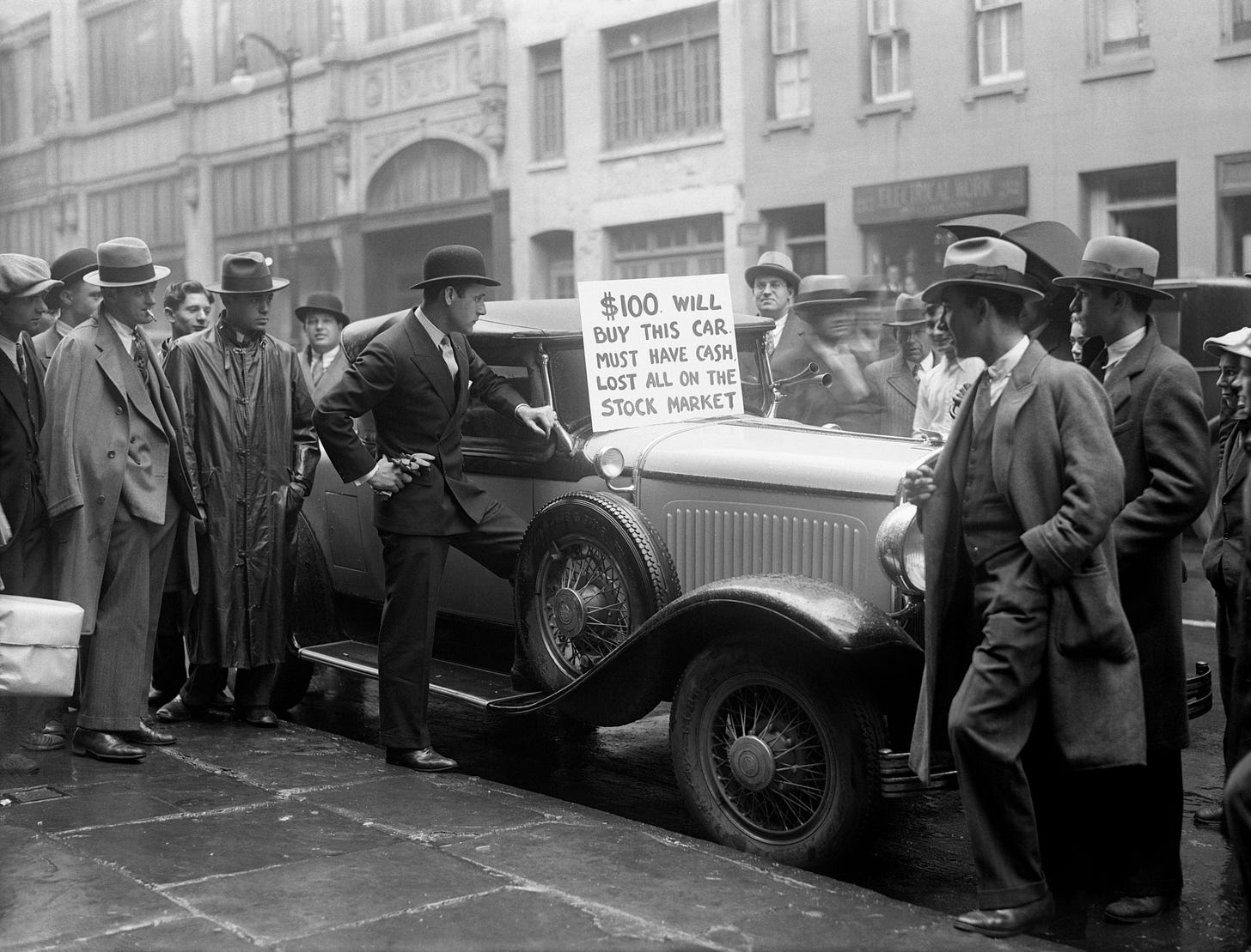 A man discovering that if you can't liquidate your stocks, you can't liquidate your car.