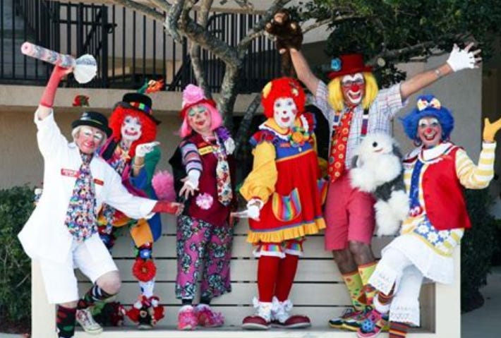 Six clowns cavorting...