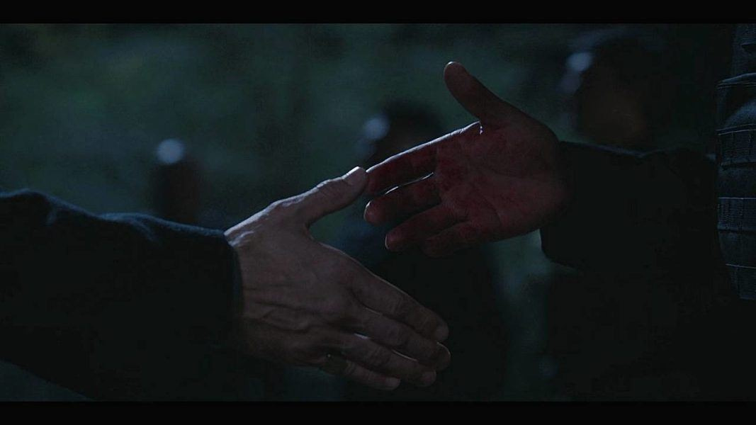 Walker 3.13 Trey and Jake Abel holding hands bloddy.