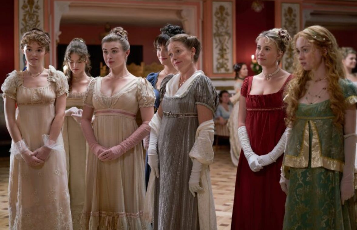 A group of six women wearing Regency dress at a ball.