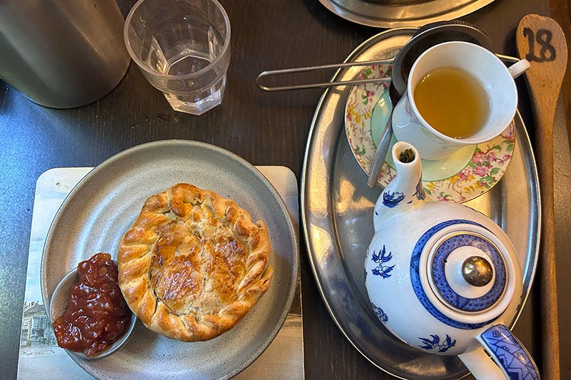 A pie with tomato chutney and a teapot with green tea from Olive at Loch.