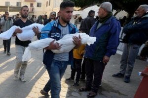 Palestinians carry the bodies of children killed in the Israeli bombardment of the Gaza Strip
