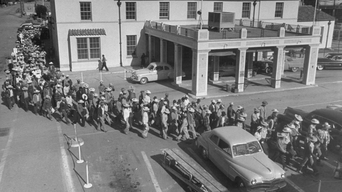 Illegal immigrants being escorted back across the border to Mexico.  (Photo by Loomis Dean/The LIFE Picture Collection/Getty Images)