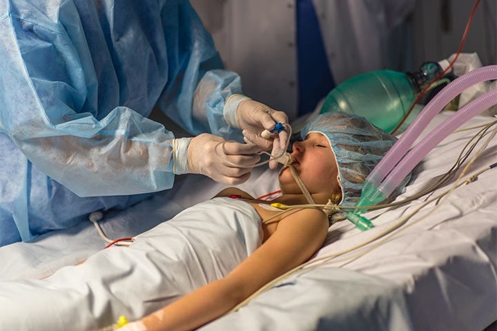 A photo of a child on a ventilator to prevent death from COVID-19